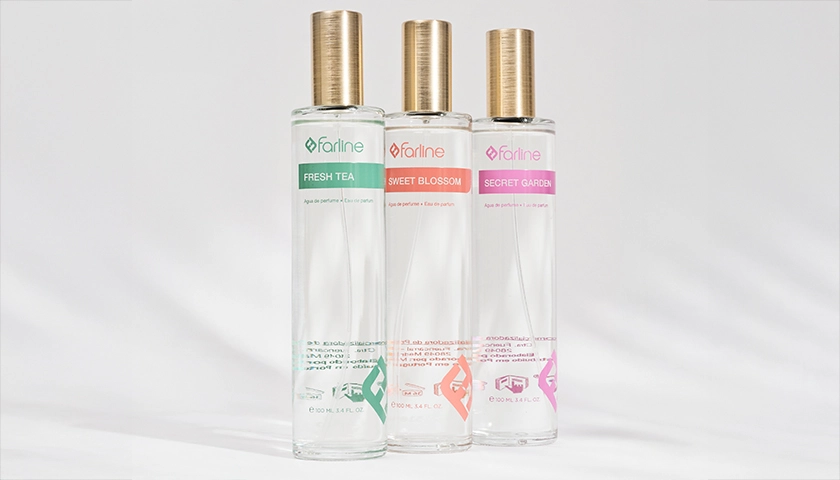 Tres frascos de agua de perfume de Farline sobre fondo blanco.